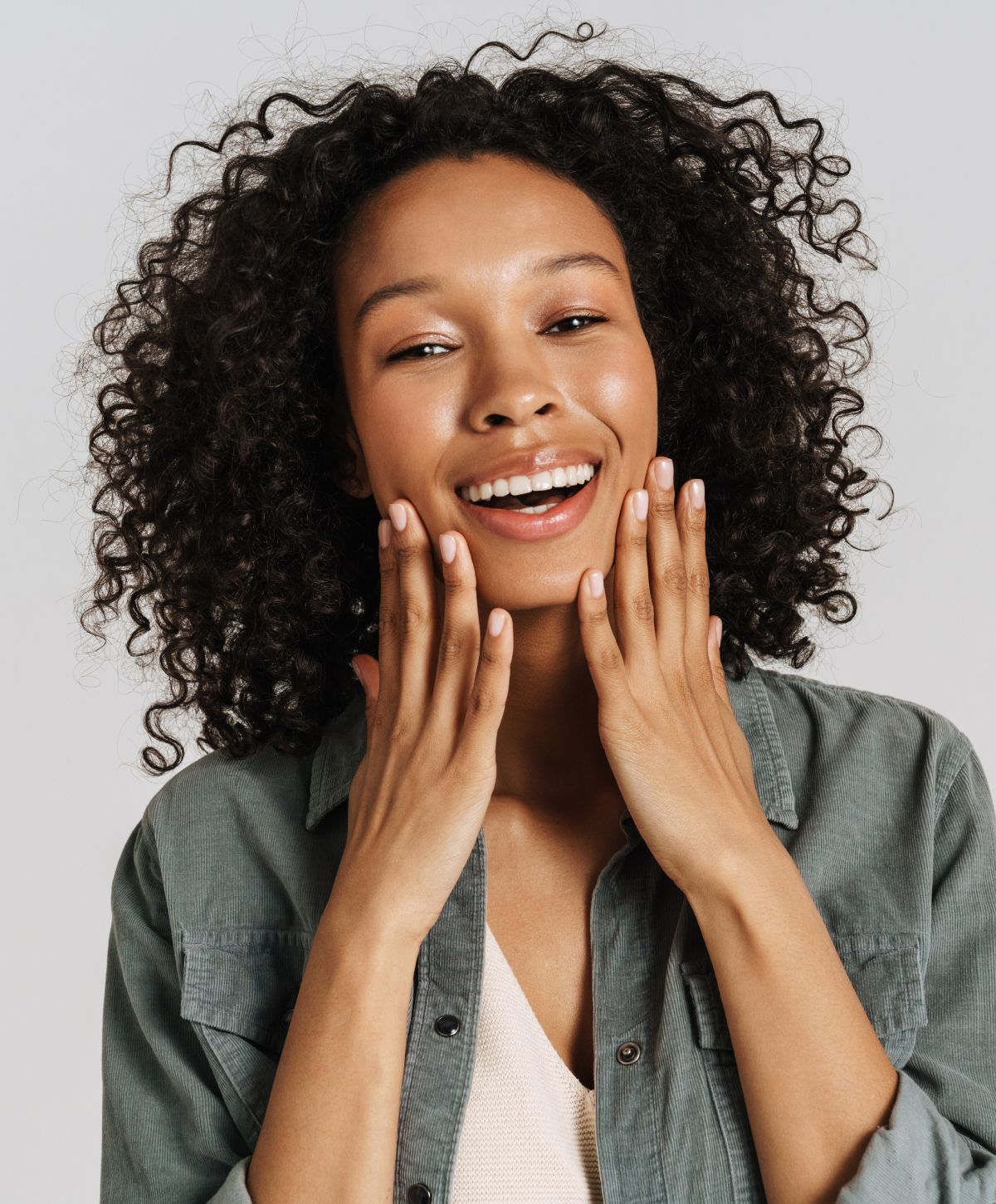 vi peel patient model touching her face and laughing